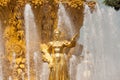 Golden statue of the fountain `Friendship of Nations` at VDNKH - a Soviet architecture in Moscow Russia